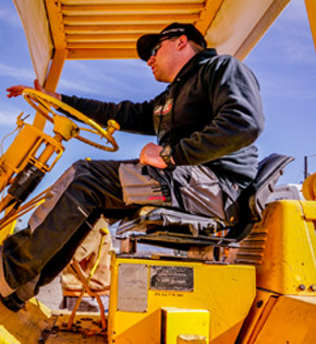 Action RV staff member riding a repair vehicle