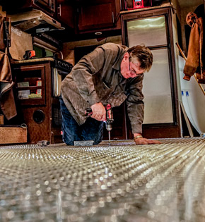 Action RV technician doing fabrication repair