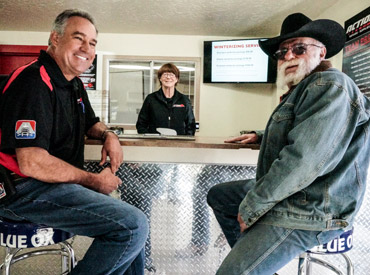 Action RV staff at a table with a client